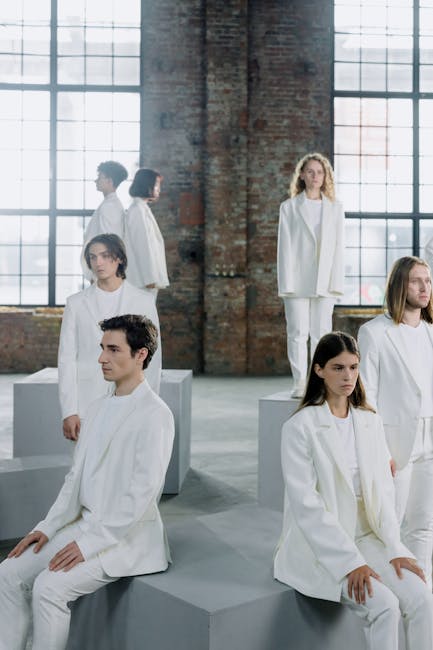 Group of diverse people sitting comfortably on yoga mats in a bright studio